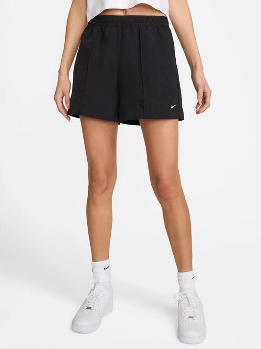 Image of a model wearing Shorts. Productname: Nike Women's Mid-Rise 5" Shorts in BLACK/WHITE colour by brand - Nike
