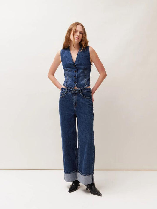 Image of a model wearing Denim. Productname: Lulu & Rose Tia Denim Vest in Dark Wash colour by brand - Lulu & Rose