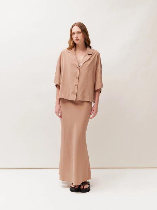Image of a model wearing Skirts. Productname: Lulu & Rose Tulli Midi Skirt in Latte colour by brand - Lulu & Rose