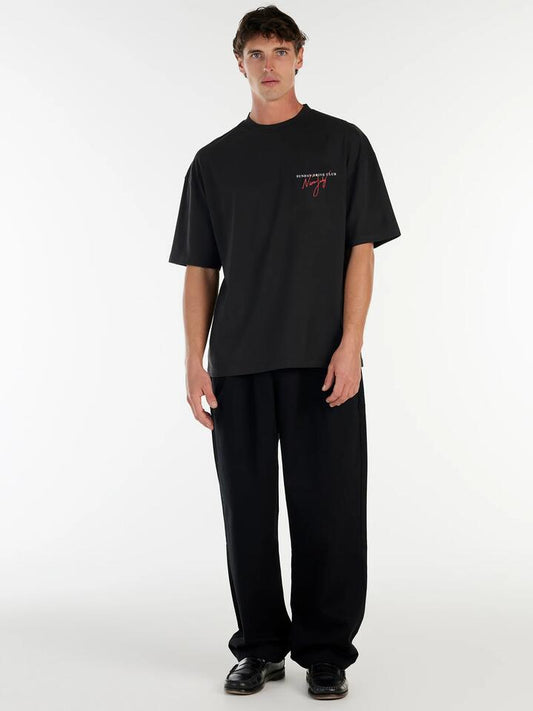 Image of a model wearing Tops. Productname: Nana Judy Bennett Tee in Black colour by brand - Nana Judy