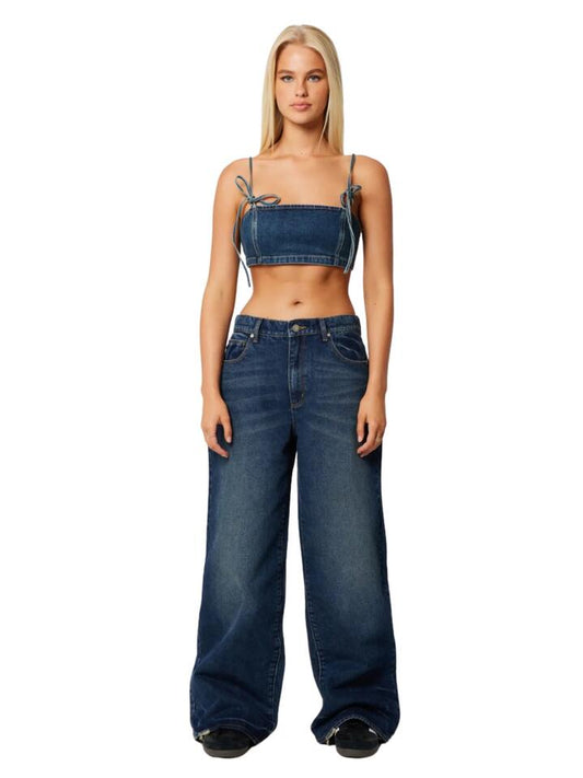 Image of a model wearing Denim. Productname: Abrand 95 Mid Super Baggy Cory in Tint Dark Blue colour by brand - Abrand