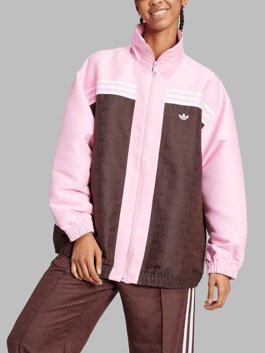 Image of a model wearing Outerwear. Productname: Adidas Oversized Track Jacket in True Pink/Shadow Brown colour by brand - Adidas