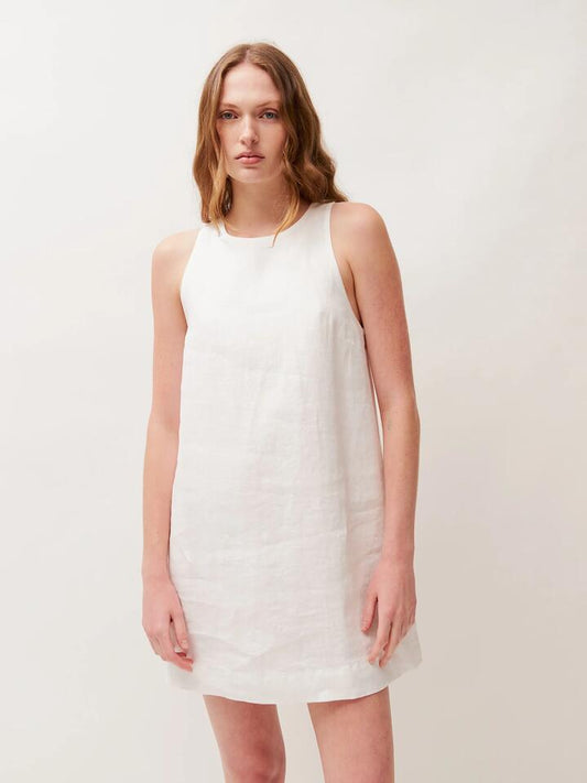 Image of a model wearing Dress. Productname: Lulu & Rose Rowie Mini Dress in Off White colour by brand - Lulu & Rose