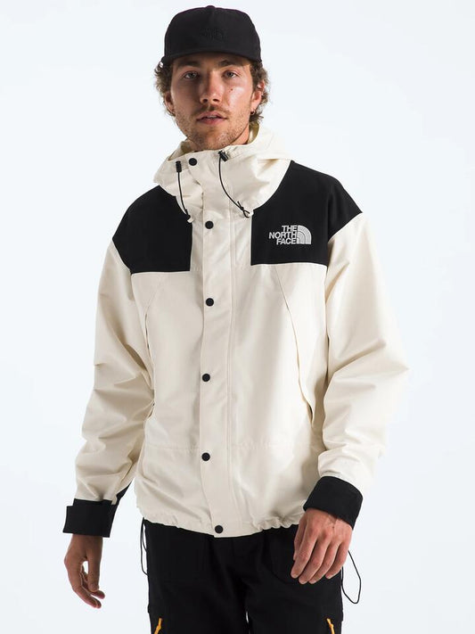 Image of a model wearing Outerwear. Productname: The North Face Men's DryVent Mono Mountain Jacket in White Dune/Tnf Black colour by brand - The North Face