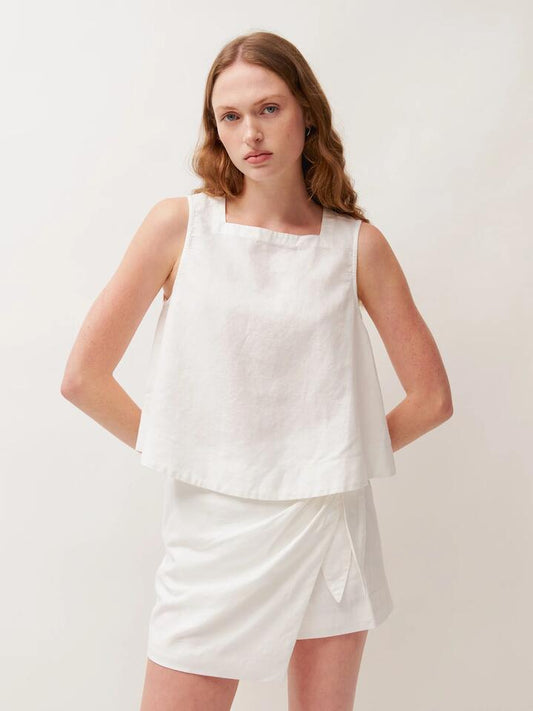 Image of a model wearing Tops. Productname: Lulu & Rose Aria Top in Off White colour by brand - Lulu & Rose