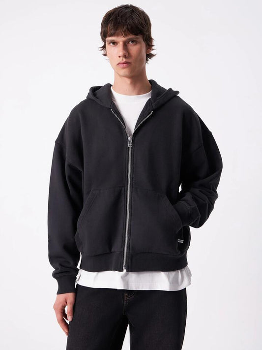 Image of a model wearing Outerwear. Productname: Article One Evren Hoodie in Washed Black colour by brand - Article One