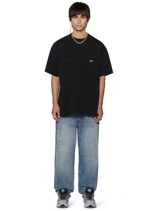 Image of a model wearing Tops. Productname: Ksubi Stamp Ekcess Pocket SS Tee in Black colour by brand - Ksubi
