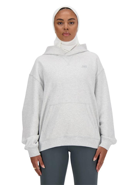 Image of a model wearing Outerwear. Productname: New Balance Athletics French Terry Hoodie in Ash Heather colour by brand - New Balance