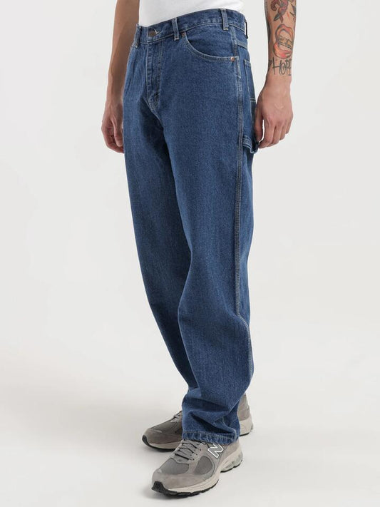 Image of a model wearing Denim. Productname: Dickies Relaxed Fit Carpenter Jeans in Stone Wash colour by brand - Dickies