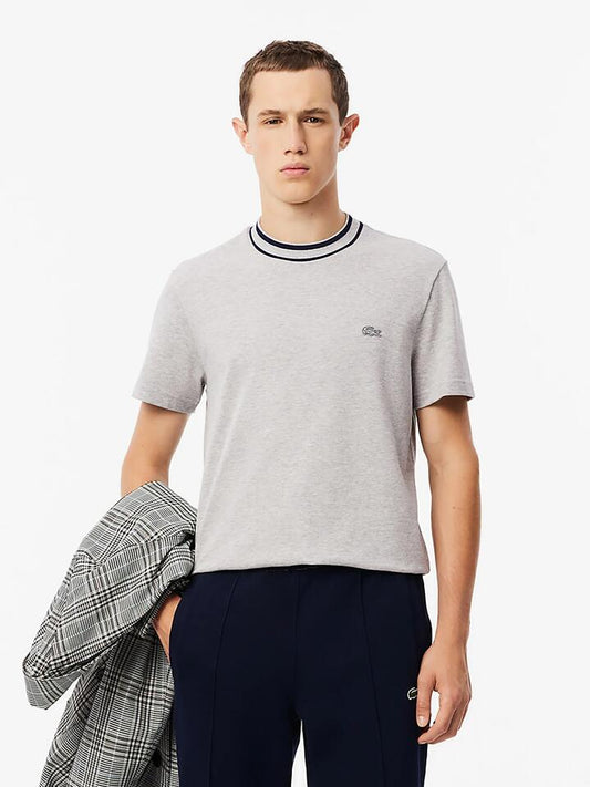 Image of a model wearing Tops. Productname: Lacoste Essential Stretch Mini Pique T-Shirt in Silver colour by brand - Lacoste