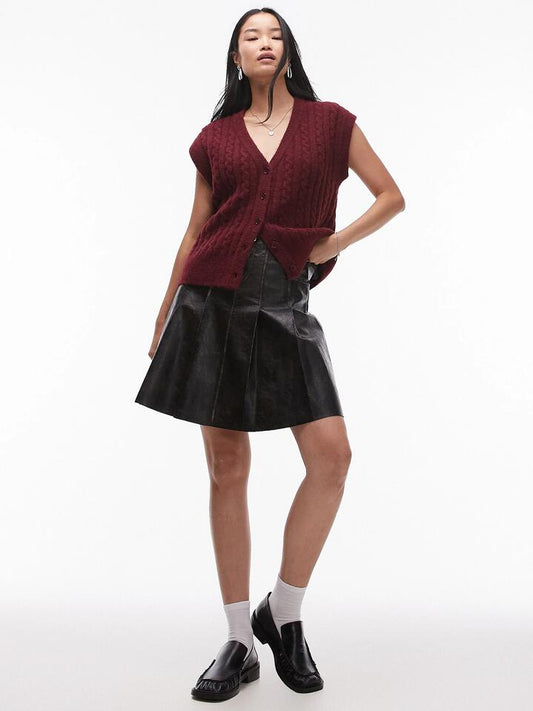 Image of a model wearing Outerwear. Productname: Topshop Knitted Cable Waistcoat in Burgundy colour by brand - Topshop
