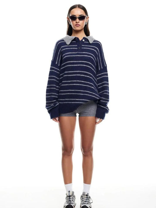 Image of a model wearing Tops. Productname: Lioness Rising Sun Jersey in NAVY colour by brand - Lioness