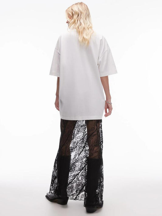 Image of a model wearing Skirts. Productname: Topshop Diagonal Tiered Floral Lace Maxi Skirt in Black colour by brand - Topshop