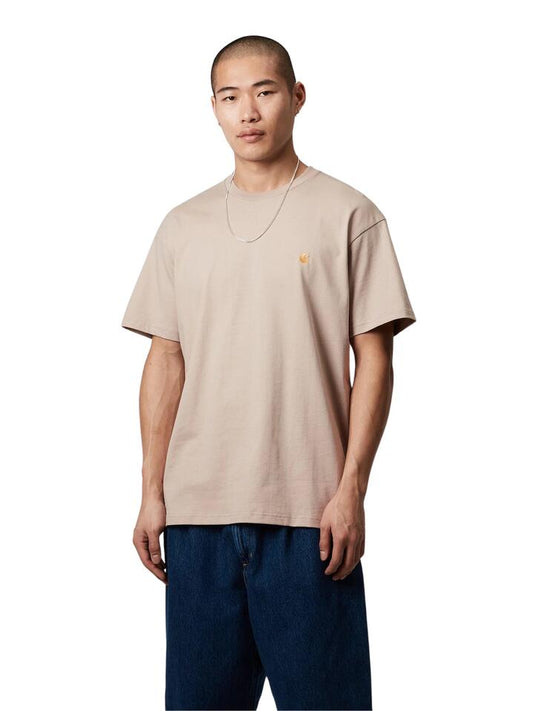 Image of a model wearing Tops. Productname: Carhartt Wip Chase T-Shirt in Dusky Beige/Gold colour by brand - Carhartt Wip