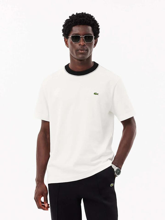 Image of a model wearing Tops. Productname: Lacoste MIF Contrast Stitch Jersey T-Shirt in Flour colour by brand - Lacoste