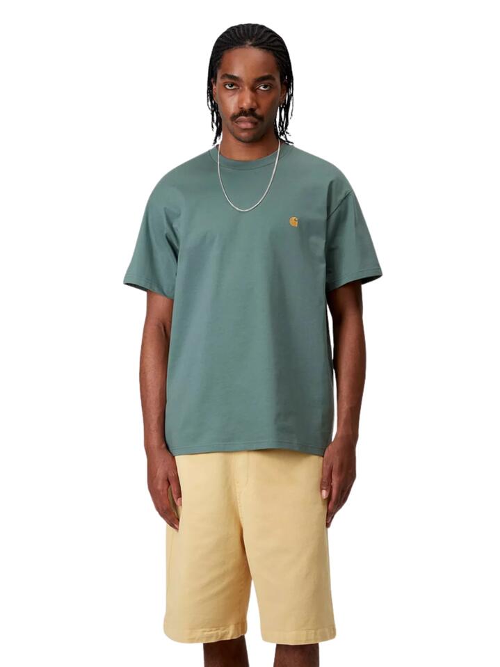 Image of a model wearing Tops. Productname: Carhartt Wip Chase T-Shirt in Silver Pine / Gold colour by brand - Carhartt Wip