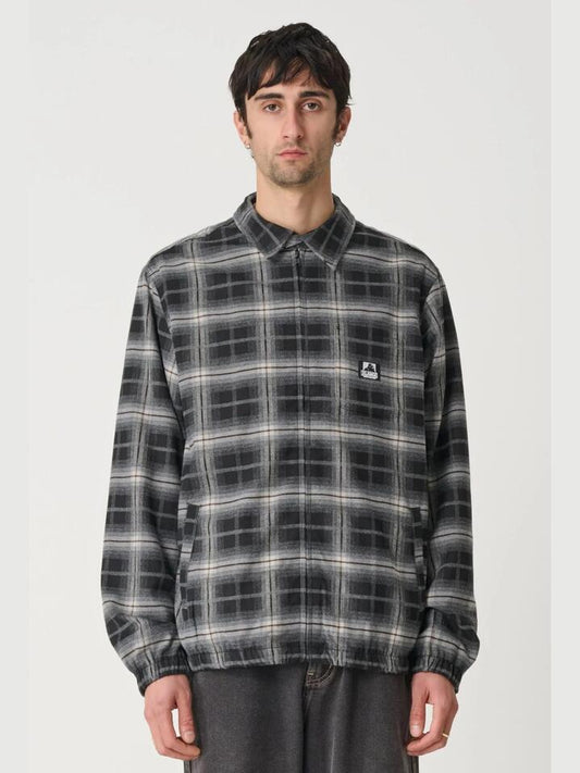 Image of a model wearing Outerwear. Productname: Xlarge Blended Check Zip Jacket in BLACK colour by brand - Xlarge