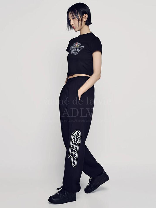 Image of a model wearing Tops. Productname: ADLV Powerpuff Girls x ADLV Crop T-Shirt in BLACK colour by brand - ADLV