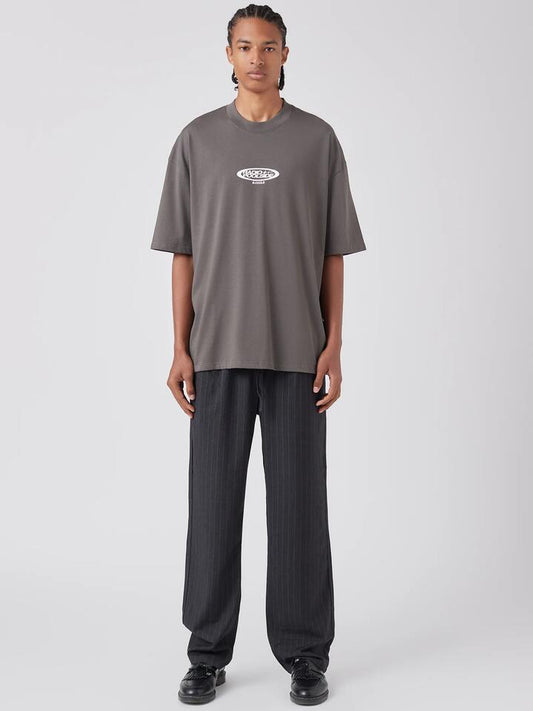 Image of a model wearing Tops. Productname: Barney Cools Radio Tee in Washed Black colour by brand - Barney Cools