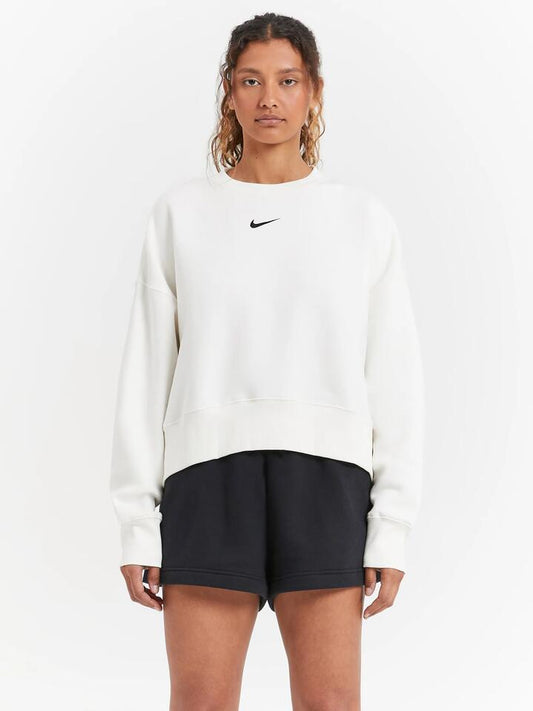 Image of a model wearing Outerwear. Productname: Nike Over Oversized Crew Neck Sweatshirt in Sail/Black colour by brand - Nike