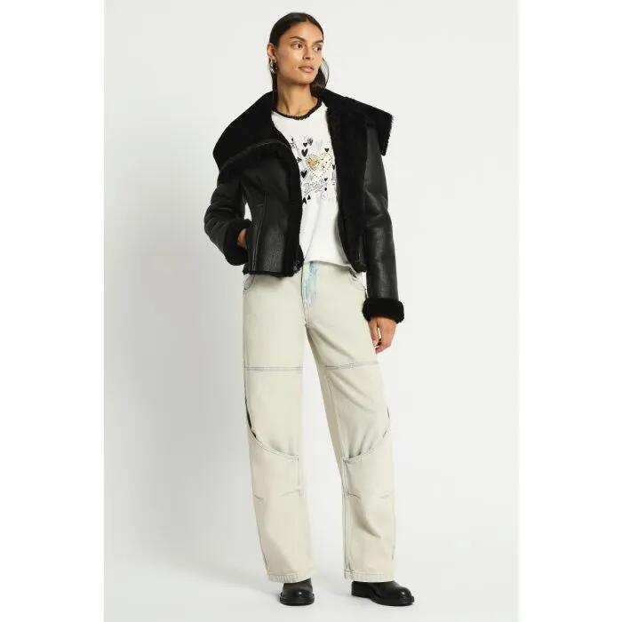 Image of a model wearing Outerwear. Productname: Dramatic Pause Shearling Jacket in Black colour by brand - sass and bide