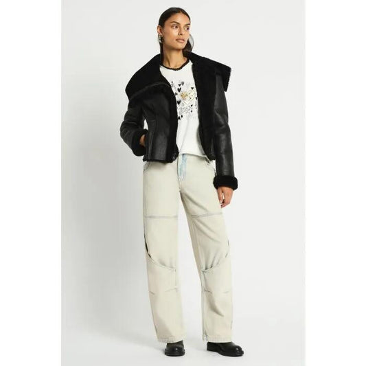 Image of a model wearing Outerwear. Productname: Dramatic Pause Shearling Jacket in Black colour by brand - sass and bide