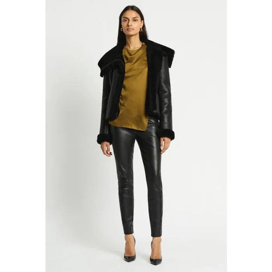 Image of a model wearing Pants. Productname: Stride Leather Leggings in Black colour by brand - sass and bide