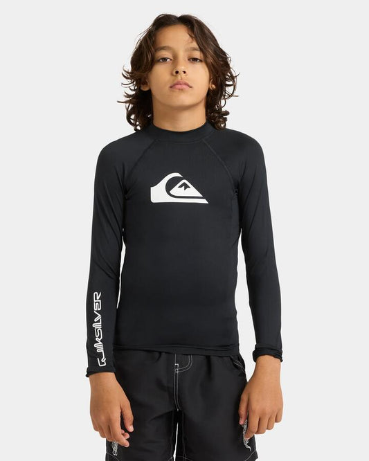 Image of a model wearing Tops. Product name - Quiksilver Boys 8-16 Everyday Long Sleeve Upf 50 Rash Vest Black in Black colour by brand - Quiksilver