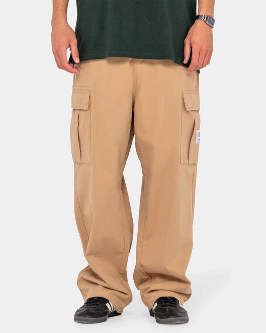 Image of a model wearing Pants. Productname: Rusty - Mens Commando Cargo Pants - Light Khaki - in Light Khaki colour by brand - Rusty
