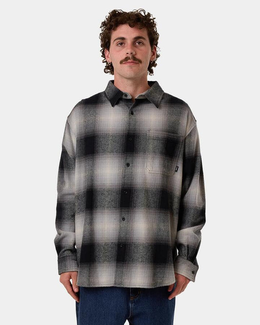 Image of a model wearing Tops. Productname: Thrills - Mens Barrio Long Sleeve Flannel Shirt - Black - in Black colour by brand - Thrills