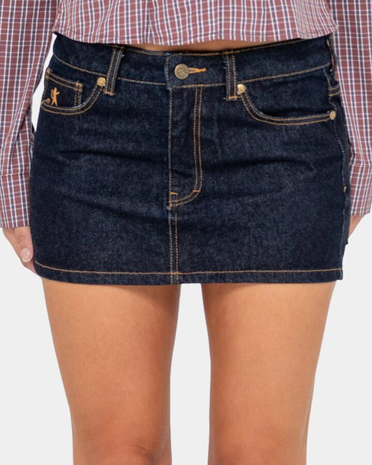 Image of a model wearing Skirts. Productname: Rusty - Womens Risque Low Rise Micro Denim Skirt - Raw Dawg - in Raw Dawg colour by brand - Rusty