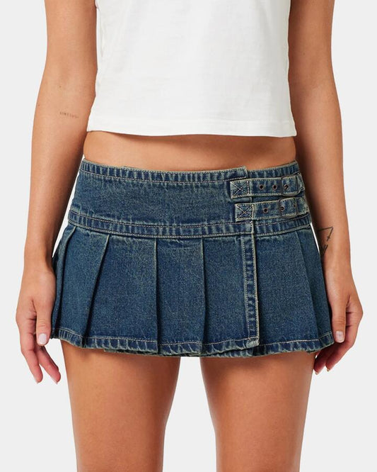 Image of a model wearing Skirts. Productname: A Brand Womens A Brand X Rip Curl 99 Plt Denim Skirt Tint Dark Blue - in Tint Dark Blue colour by brand - A Brand