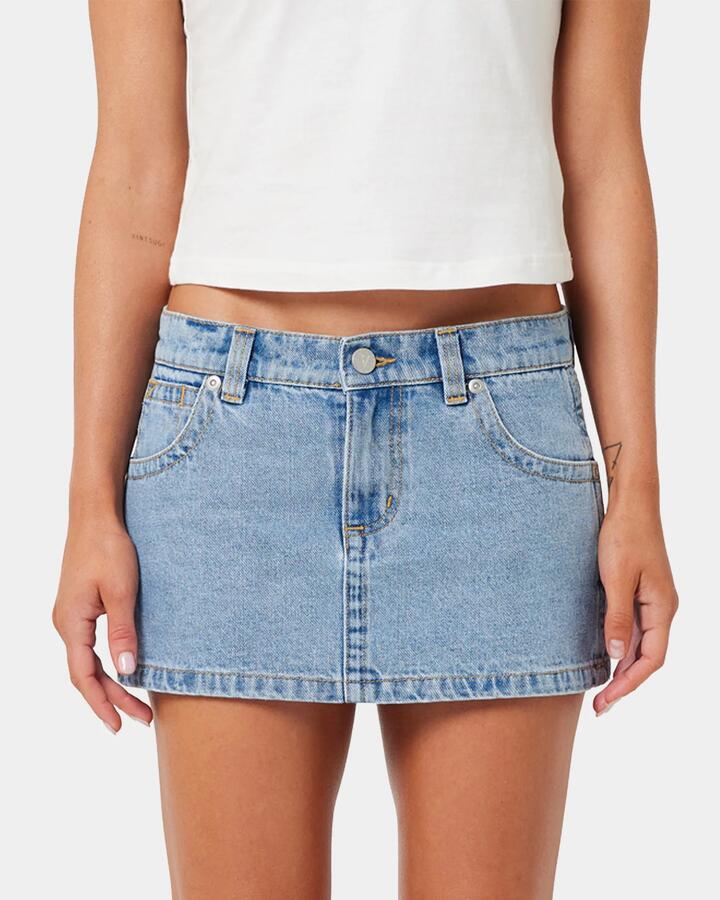 Image of a model wearing Skirts. Productname: A Brand - Womens A Brand X Rip Curl 99 Denim Skirt - Light Vintage Blue - in Light Vintage Blue colour by brand - A Brand