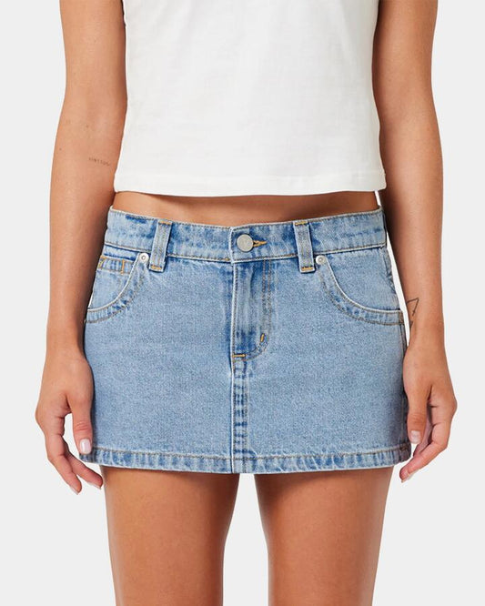 Image of a model wearing Skirts. Productname: A Brand - Womens A Brand X Rip Curl 99 Denim Skirt - Light Vintage Blue - in Light Vintage Blue colour by brand - A Brand