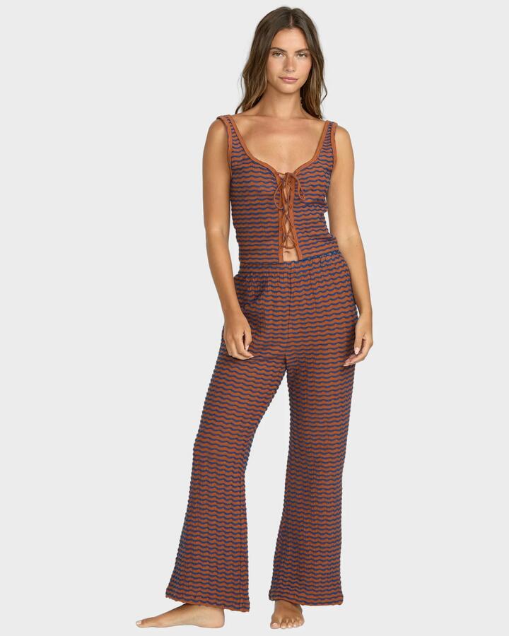 Image of a model wearing Pants. Product name - Billabong Womens Hot Tides Trousers Sedona in Sedona colour by brand - Billabong