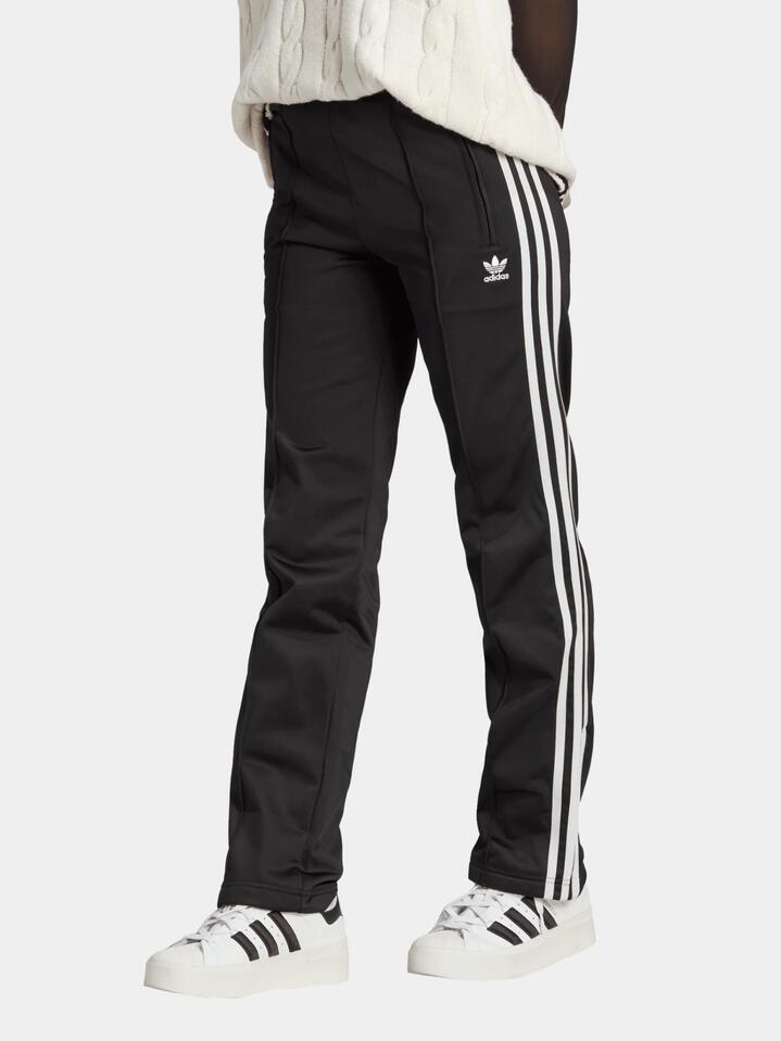 Image of a model wearing Pants. Productname: Adidas Womens Firebird Track Pant in Black colour by brand - Adidas