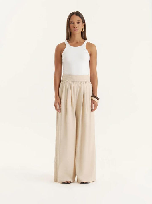Image of a model wearing Pants. Productname: 4th & Reckless Milo Trouser in Beige colour by brand - 4th & Reckless