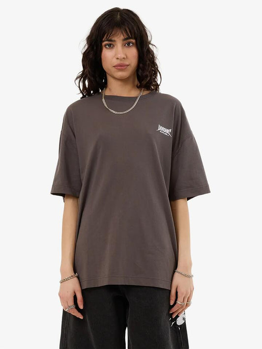 Image of a model wearing Tops. Productname: Worship Nuclear Relaxed Fit Tee in Worn Black colour by brand - Worship