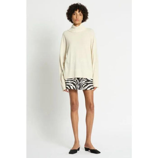 Image of a model wearing Outerwear. Productname: Lucillian Roll Neck Jumper in EGGSHELL colour by brand - sass and bide