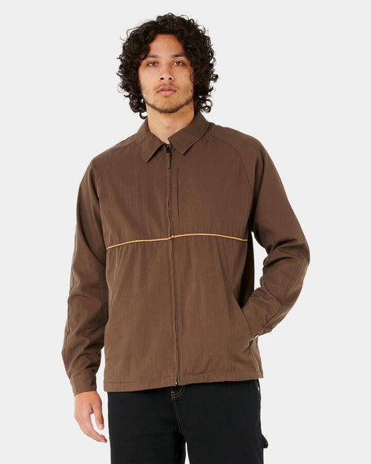 Image of a model wearing Outerwear. Productname: Rip Curl - Mens Archive Coach Jacket - Coffee - in Coffee colour by brand - Rip Curl