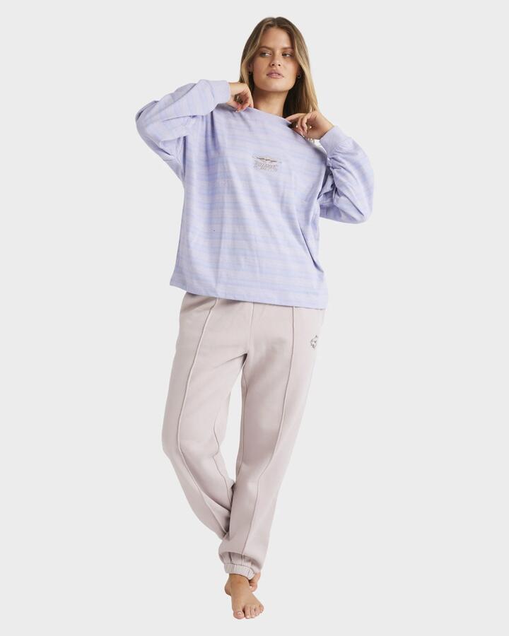 Image of a model wearing Pants. Productname: Billabong - Womens The Original Vibes Track Pants - Multi - in Multi colour by brand - Billabong