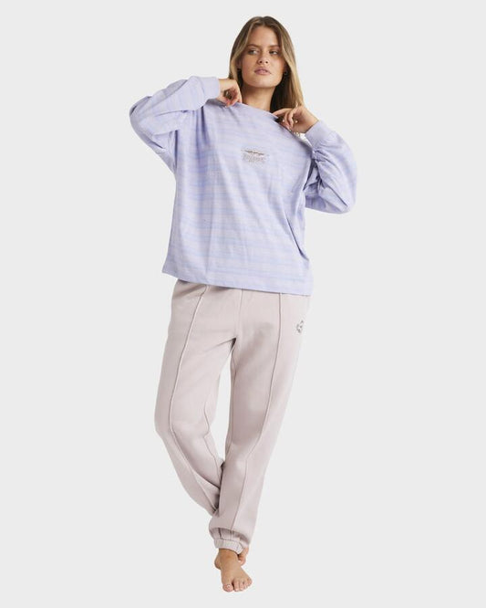Image of a model wearing Pants. Productname: Billabong - Womens The Original Vibes Track Pants - Multi - in Multi colour by brand - Billabong