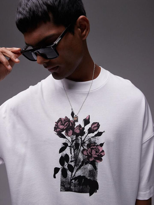 Image of a model wearing Tops. Productname: Topman Floral Print Oversized T-Shirt in White colour by brand - Topman
