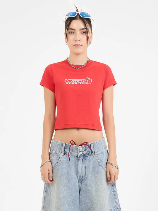 Image of a model wearing Tops. Productname: Worship Push Off Teeny Tee in Lucky Red colour by brand - Worship