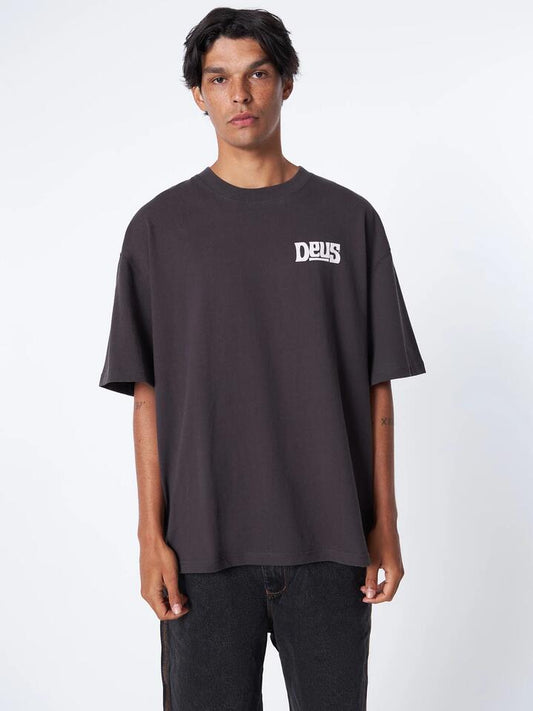 Image of a model wearing Tops. Productname: Deus Soundworm Tee in Anthracite colour by brand - Deus