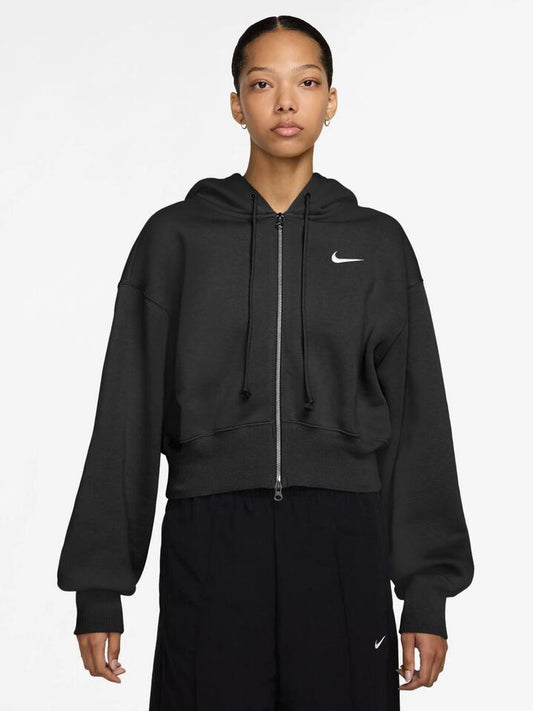 Image of a model wearing Outerwear. Productname: Nike Women's Loose Cropped Full-Zip Hoodie in Black/Sail colour by brand - Nike