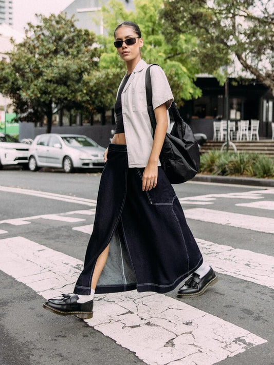 Image of a model wearing Skirts. Productname: Larriet Wrap Skirt in Indigo colour by brand - Larriet