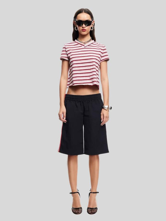Image of a model wearing Shorts. Productname: Lioness Sevigney Long Short in Onyx colour by brand - Lioness
