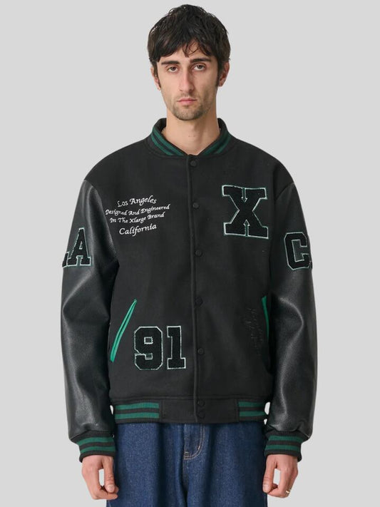 Image of a model wearing Outerwear. Productname: Xlarge OG Jacket in GREEN colour by brand - Xlarge