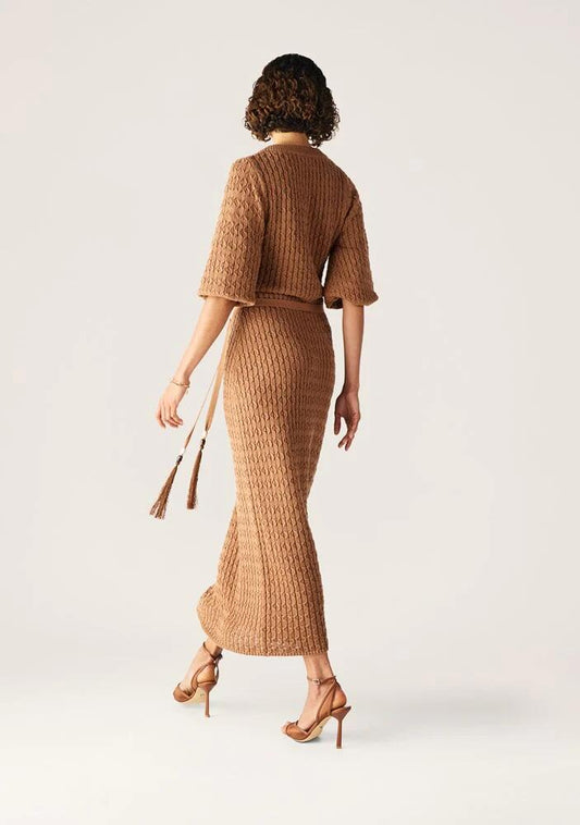Image of a model wearing Dress. Productname: Furilia Knit Maxi Dress in Nutshell colour by brand - MOS The Label